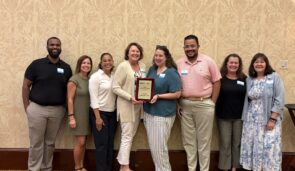 Dominion team with their award
